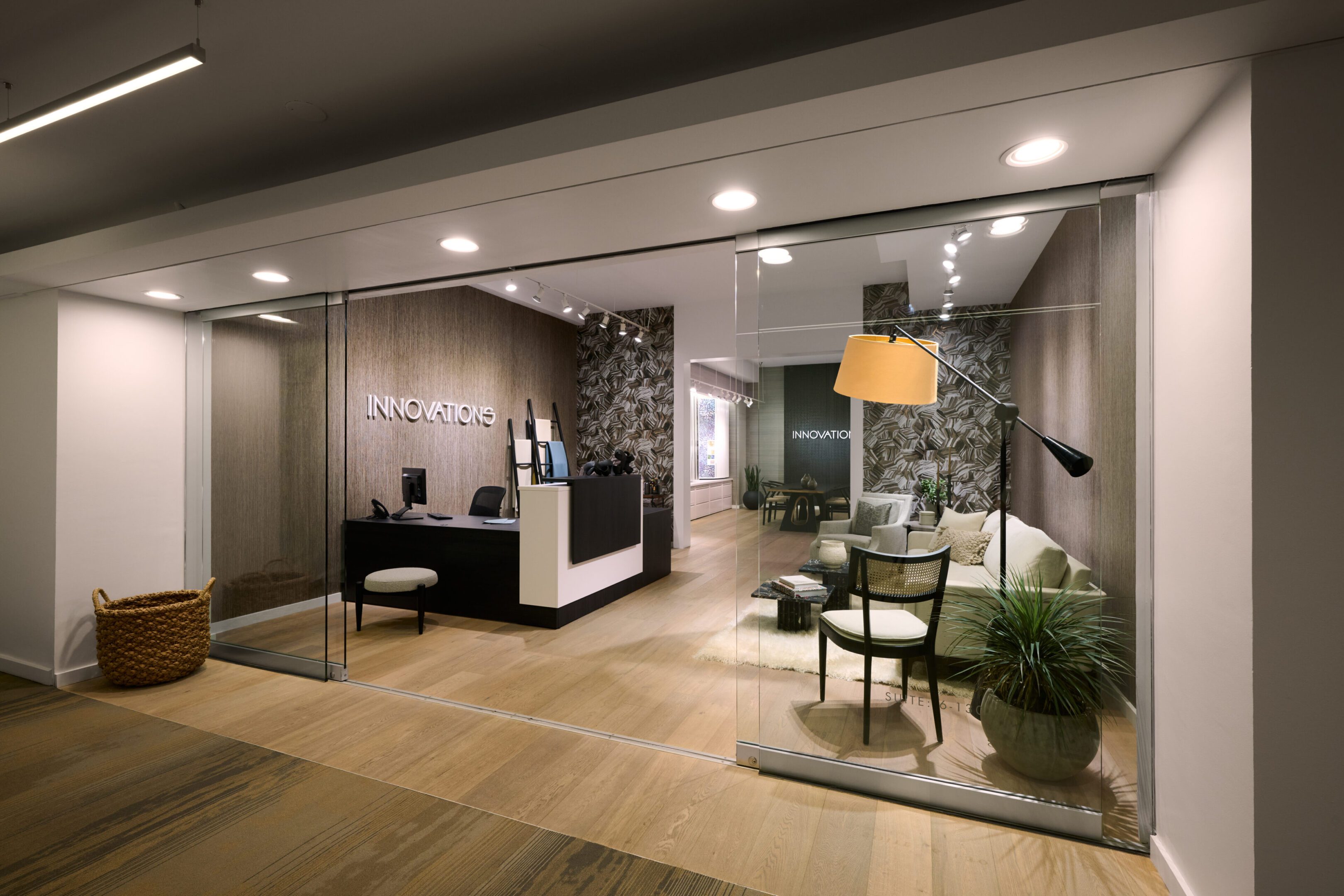 A reception area with chairs and tables in it.
