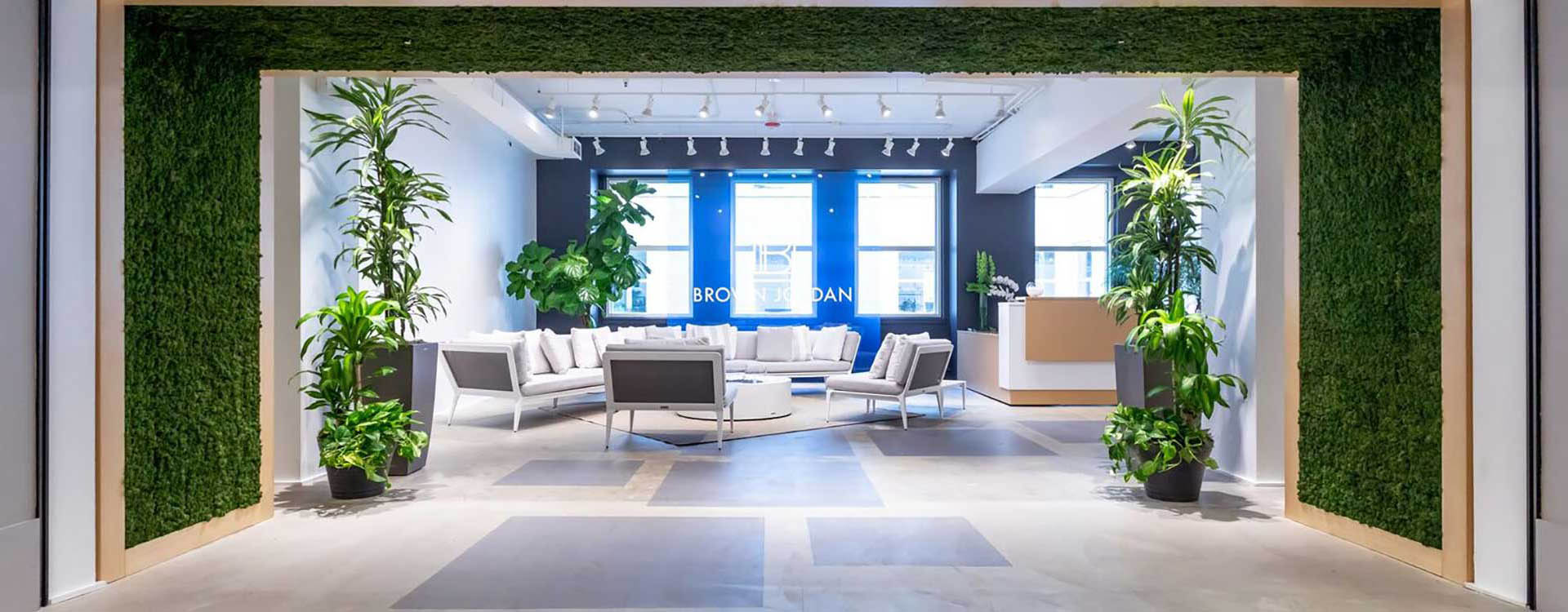 A room with many couches and tables in it