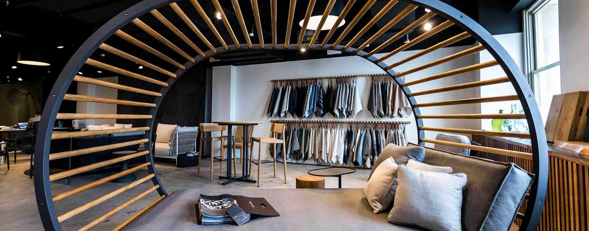 A room filled with lots of clothes hanging on the wall.