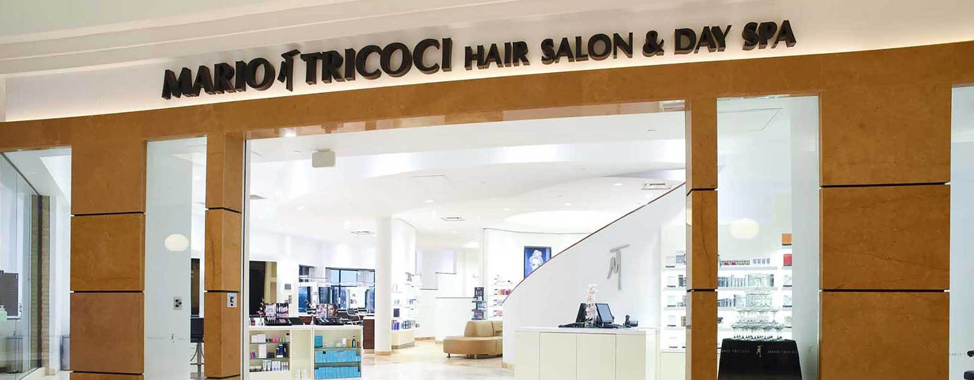 A hair salon with a sign above the entrance.